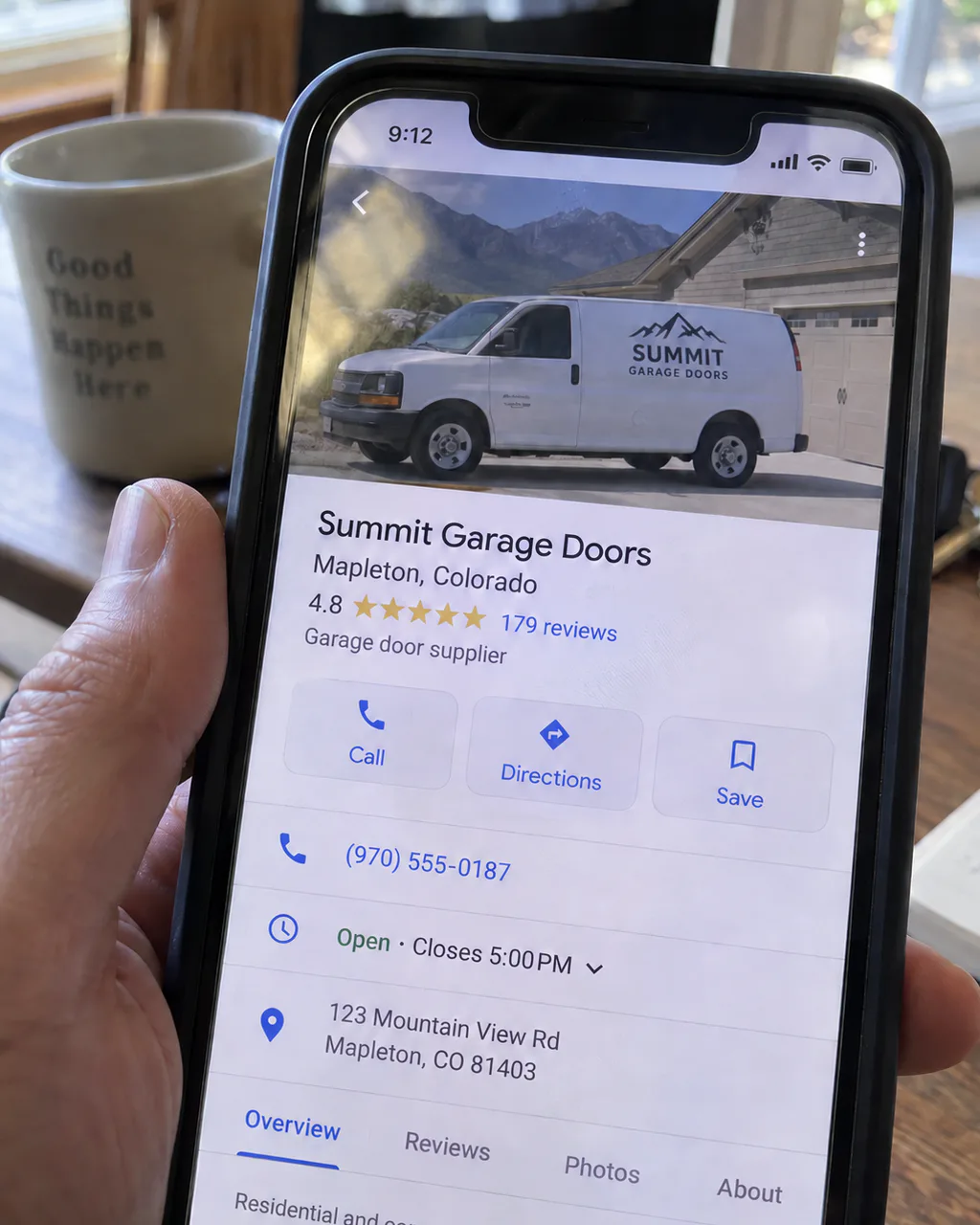 Candid phone photo of the Summit Garage Doors Maps listing with no website button